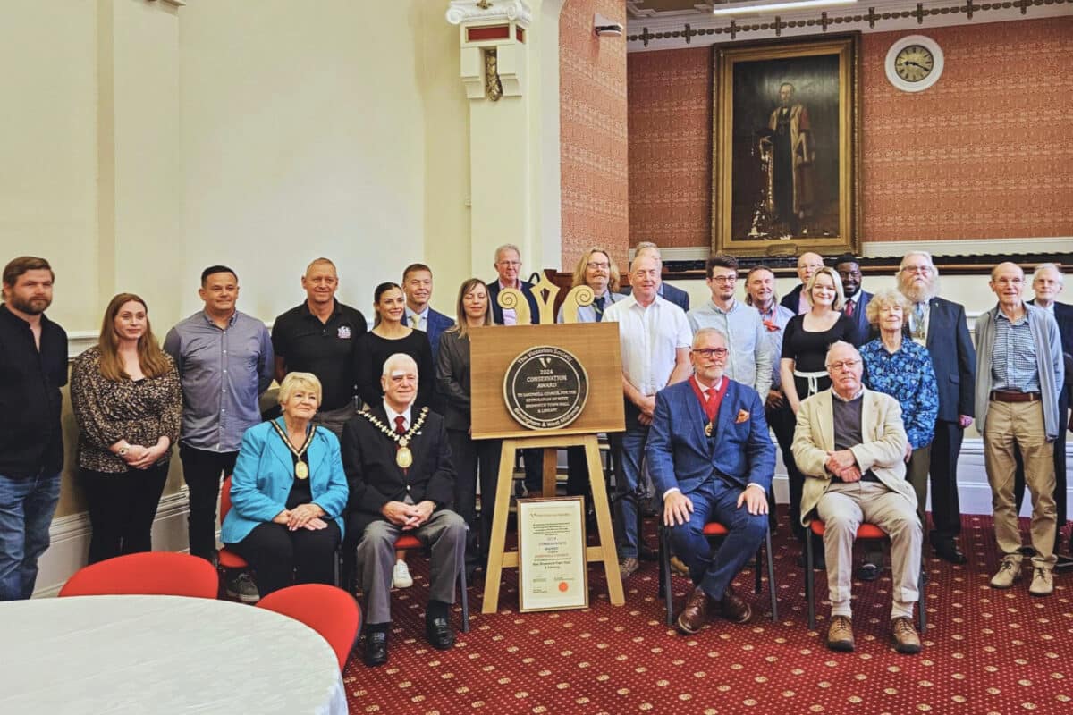 Team of contractors, Victorian Society members, and Sandwell Council representatives receiving the Victorian Society Birmingham & West Midlands Group Conservation Award at West Bromwich Town Hall