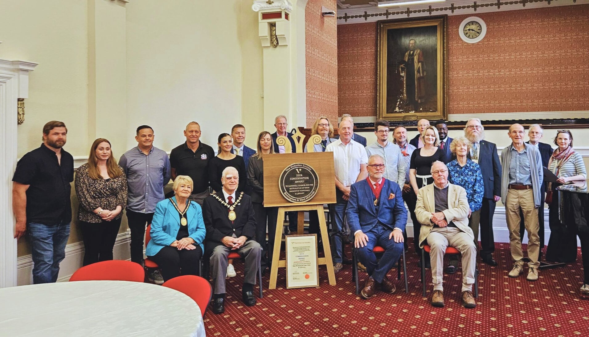 Team of contractors, Victorian Society members, and Sandwell Council representatives receiving the Victorian Society Birmingham & West Midlands Group Conservation Award at West Bromwich Town Hall